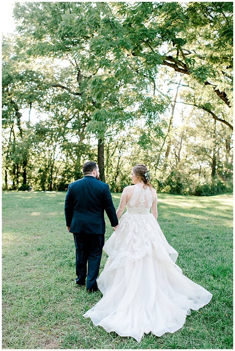 The bride and groom enjoy a private walk around the property at Great Oak Manor | My Eastern Shore Wedding