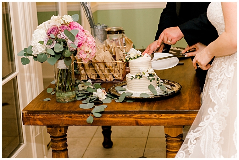 The new husband and wife cut their wedding cake | Erin Wheeler Photography