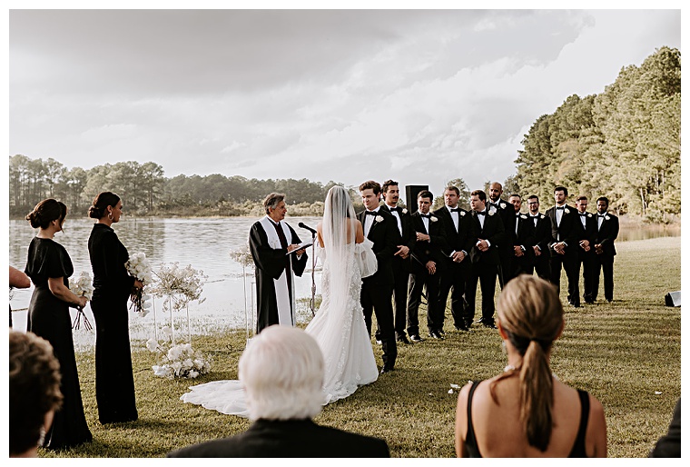 A beautiful waterfront ceremony with elegant black and white details | My Eastern Shore Wedding | Kingsbay Mansion