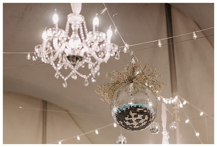A disco ball and crystal chandelier set the stage for an epic dance party to end the night at Kingsbay Mansion