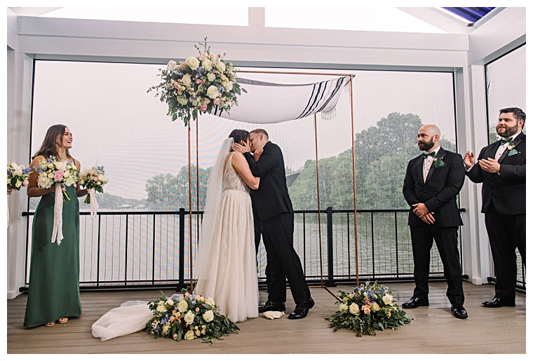 The newlyweds embrace in their first kiss as husband and wife | Laura's Focus Photography | My Eastern Shore Wedding