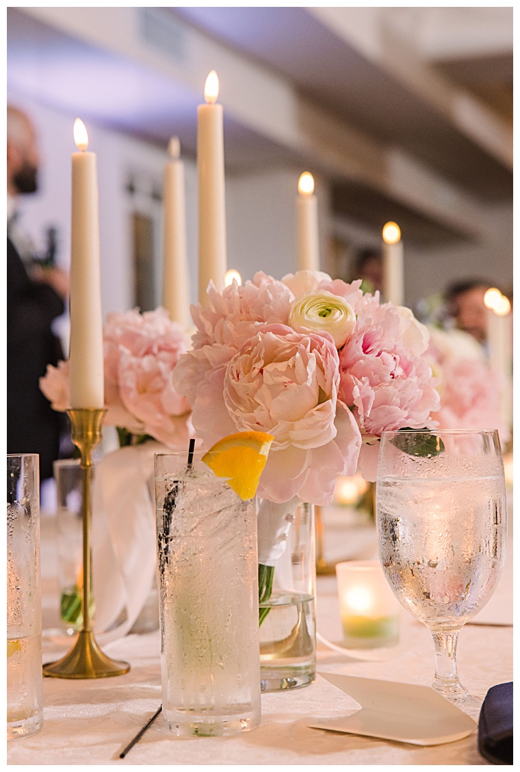 Beautiful peonies donned the tablescapes at The Oaks Waterfront Hotel for this lovely reception detailed with golden candles to light the night | Laura's Focus Photography | My Eastern Shore Wedding
