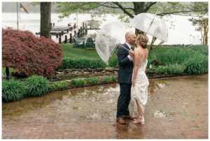 Despite the rain, these newlyweds enjoyed their first look before their ceremony with a few whimsical umbrellas to keep them dry.