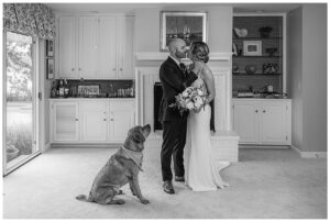 The soon to be newlyweds share a quiet moment with their fur baby before the ceremony
