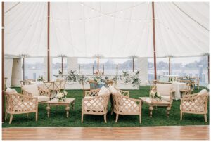 A beautiful lounge area lines the dance floor for guests to relax during the reception in this lovely Eastern Shore Tent