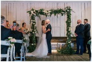 The bride and groom share their first kiss as husband and wife at their ceremony at the Chesapeake Bay Maritime Museum | My Eastern Shore Wedding
