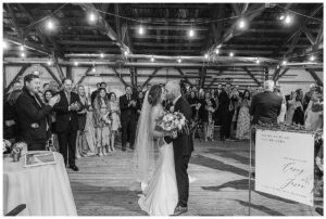 The bride and groom share a kiss at the entrance to their ceremony site | My Eastern Shore Wedding