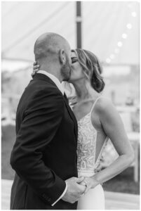 The newlyweds share in a romantic kiss during their first dance at their reception at The Chesapeake Bay Maritime Museum | My Eastern Shore Wedding