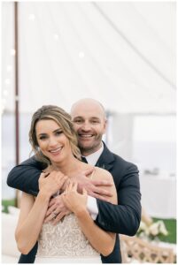 The newlyweds embrace in a hug following their ceremony | My Eastern Shore Wedding