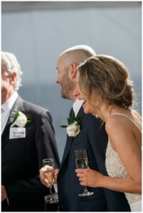 The newlyweds laugh along with the toasts during their reception at The Chesapeake Bay Maritime Museum | My Eastern Shore Wedding