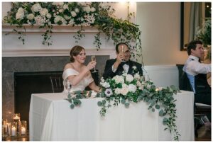 The newlyweds enjoy the toasts in their honor at their private sweethearts table