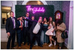Photobooth shenanigans with a neon sign custom made for the newlyweds