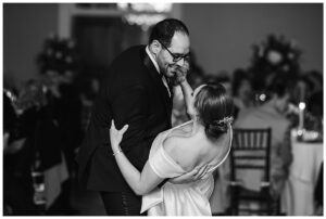 The groom dips his new wife during their first dance