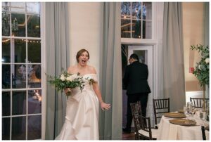 The bride and groom share in the excitement as they see their reception space for the first time