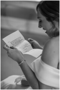 The bride reads a note from her groom before they meet for the ceremony