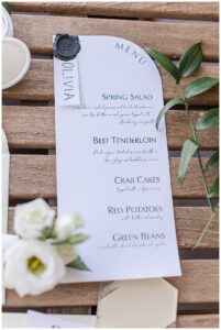 Tables are detailed with menu cards to display the lovely meal of the evening