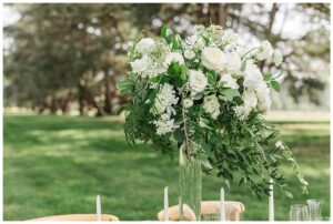 White and green florals detail the tablescapes