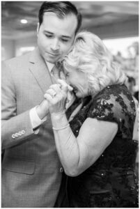 The groom shares a dance with his mother during the wedding reception, captured in classic Black and white photography by Simply Picturesque Photography