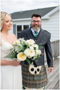 The bride celebrates with her father following their very own first look