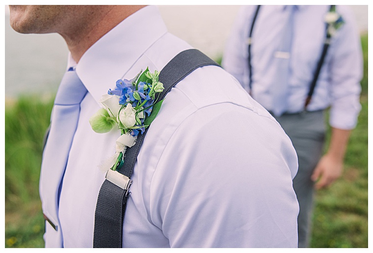 The groomsmen are decorated with small blue florals by Sherwood Florist for this colorful wedding day that perfectly match their pastel blue ties.