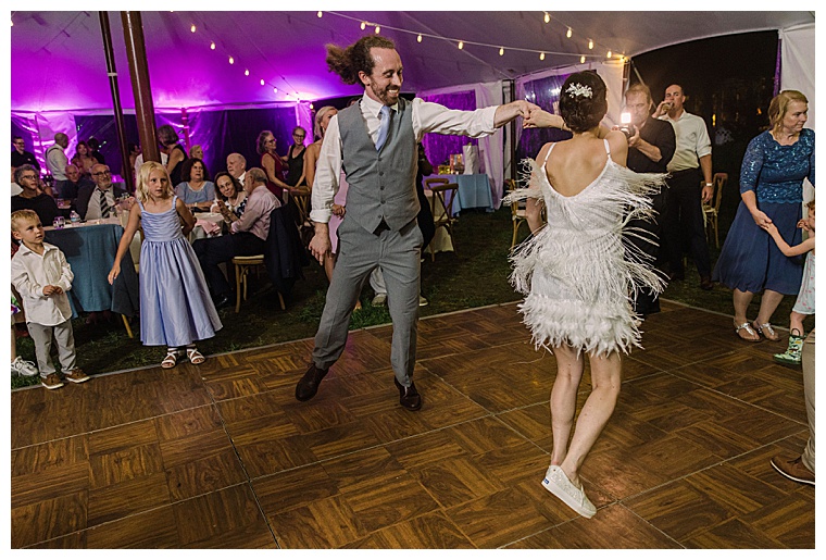 The newlyweds dance the night away at their reception after the bride changes into a white fringe reception dress and sneakers to hit the dance floor