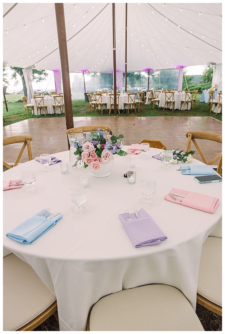 The reception tent is decorated with colorful linens to compliment the Sherwood Floral centerpieces