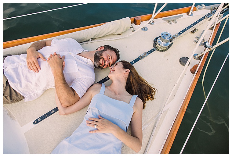 The bride and groom enjoy the sunset on the boats at CBMM, resting in the bow