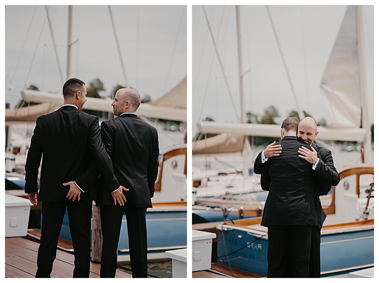 The groomsmen embrace in a hug on the dock before the ceremony