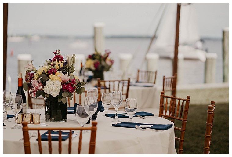 What's better than a waterfront tablescape at a beautiful wedding reception? Complete with a sailboat in the backgrounded headed out for a sunset cruise.