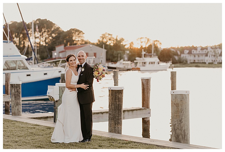 The newlyweds pose for their first portrait as husband and wife on the waterfront at the Chesapeake Bay Maritime Museum
