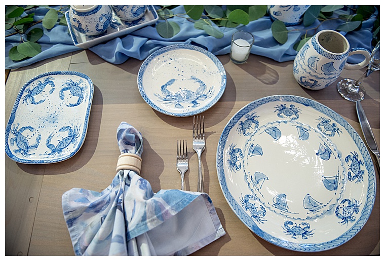 A true Eastern Shore tablescape for this wedding reception is detailed with white and blue nautical details of the MD Blue crab