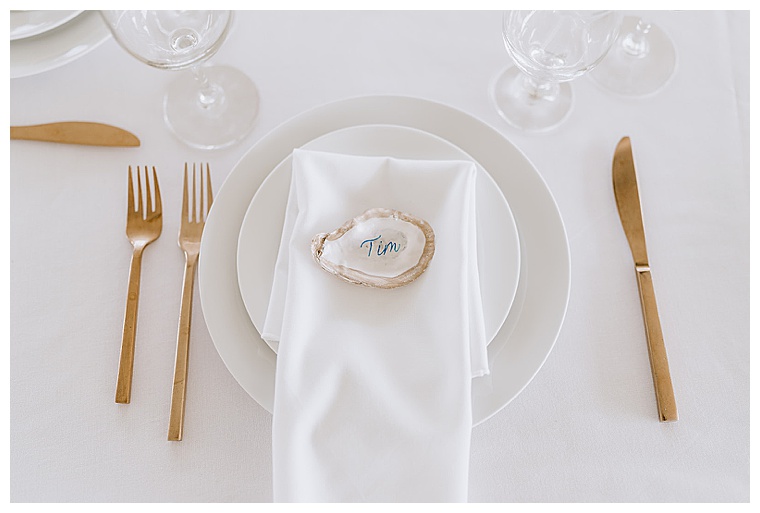 Oyster shells decoupaged with guests' names for the escort cards at the Inn at Haven Harbour