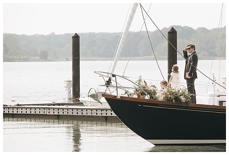 Guests board the ceremony sailboat and embark on a wedding cruise
