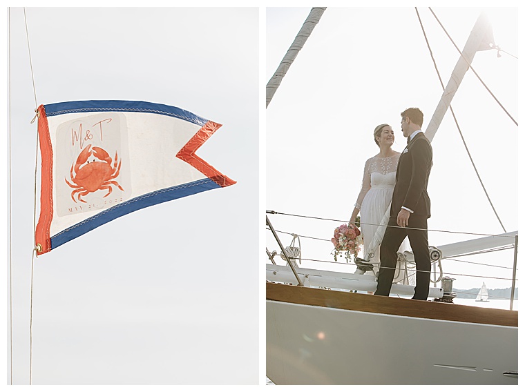 A custom wedding flag flies high over the ceremony sailboat fleet