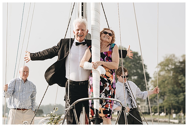 Guests celebrate an amazing wedding ceremony on a fleet of sailboats as they make their way down the tred avon river