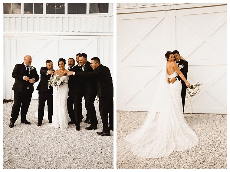 Surrounded by her supportive men, the bride shows off her new wedding ring with groomsmen cheering her on