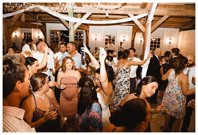 Guests hit the dance floor under some romantic fairy lights at Breckenridge Barn