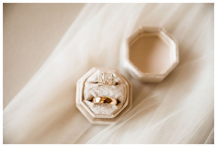Gorgeous golden wedding bands in an off-white velvet ring box for a Breckenridge Barn wedding day
