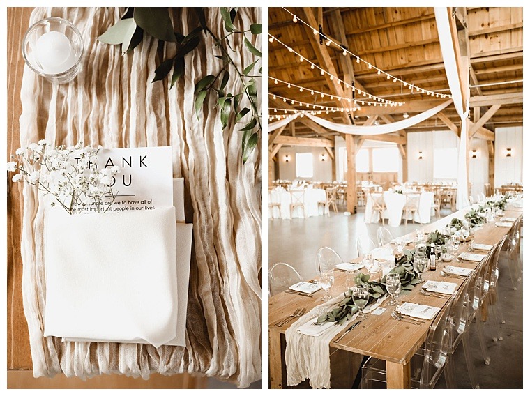 Rustic farm tables are decorated with greenery and white details to compliment this breckenridge barn wedding reception