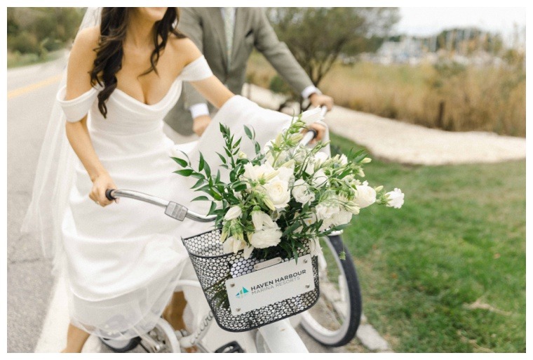 The bride and groom make their way to their wedding reception in style on a pair of Haven Harbour bicycles