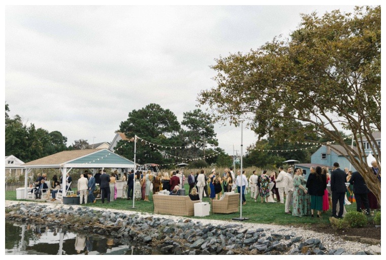 Guests enjoy a waterfront cocktail hour on the lawn at the Inn at Haven Harbour