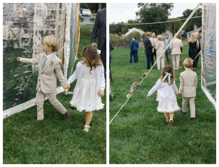 Flower girl and ring bearer enter the reception hand in hand