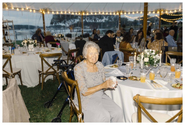 Guest enjoy a waterfront reception on the lawn at the Inn at Haven Harbour