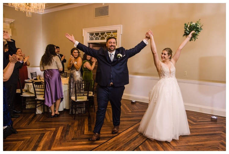 The newlyweds make their grand entrance as husband and wife to the their Tidewater Inn Reception | Laura's Focus Bridal Photography