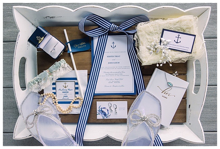 A detail image of the invitation suite, with wedding day details including the bride's jewelry and ceremony shoes