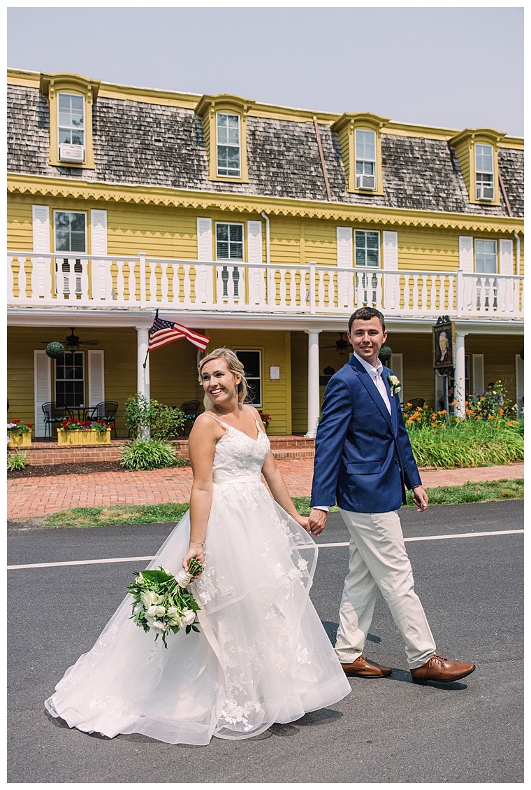 The bride and groom explore downtown Oxford MD on their wedding day during their private first look moment with Laura's Focus Photography