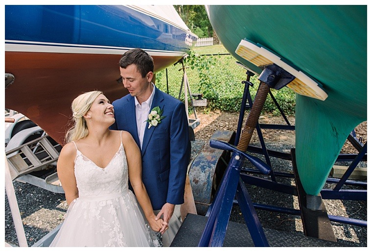 The bride and groom share a private moment in the boatyard at the Tred Avon Yacht Club