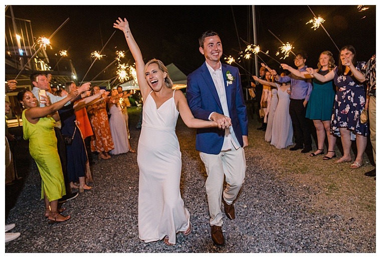 All smiles, the bride and groom exit their ceremony and embark onto married life together after their fabulous Tred Avon Yacht Club wedding