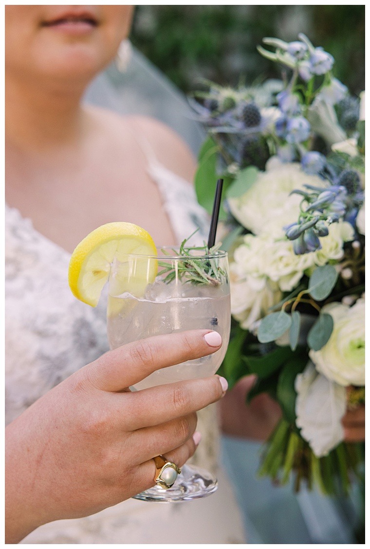Bride tastes her signature drink during her wedding reception