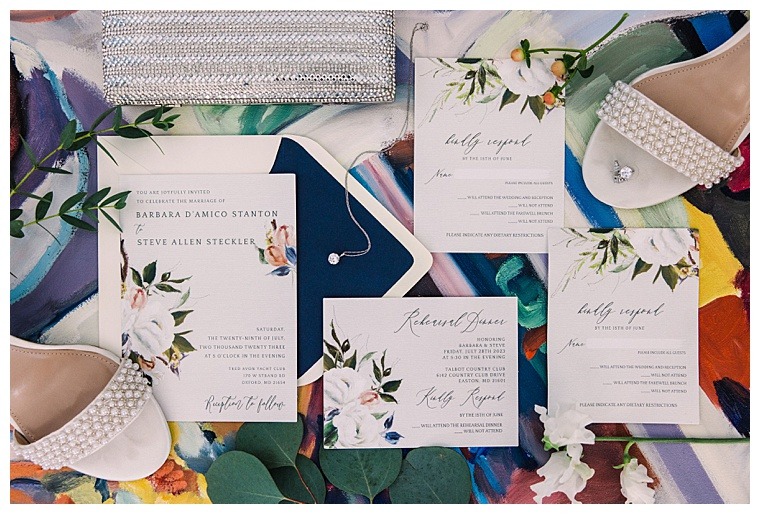 Laura's Focus Photography beautifully captured the couple's invitation suite and wedding day details in this styled image.